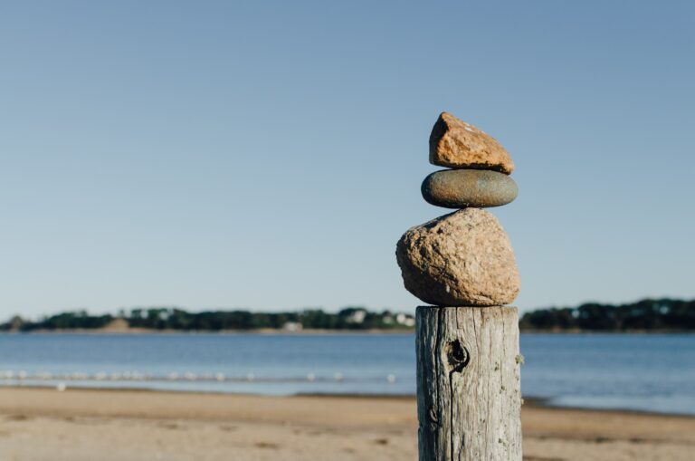 Balancing stones image, managing stress levels. Mindletic blog