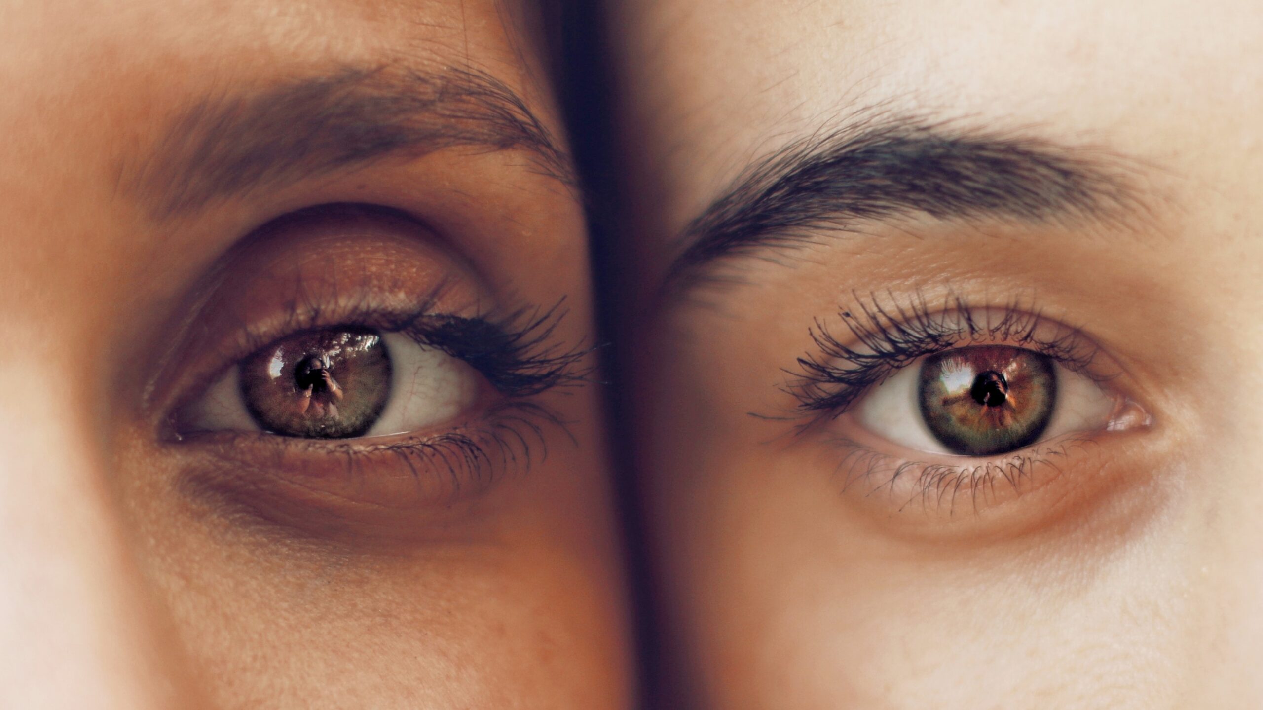 Eyes of two faces photographed close together. Extroverts and introverts - what are the differences? Mindletic Blog